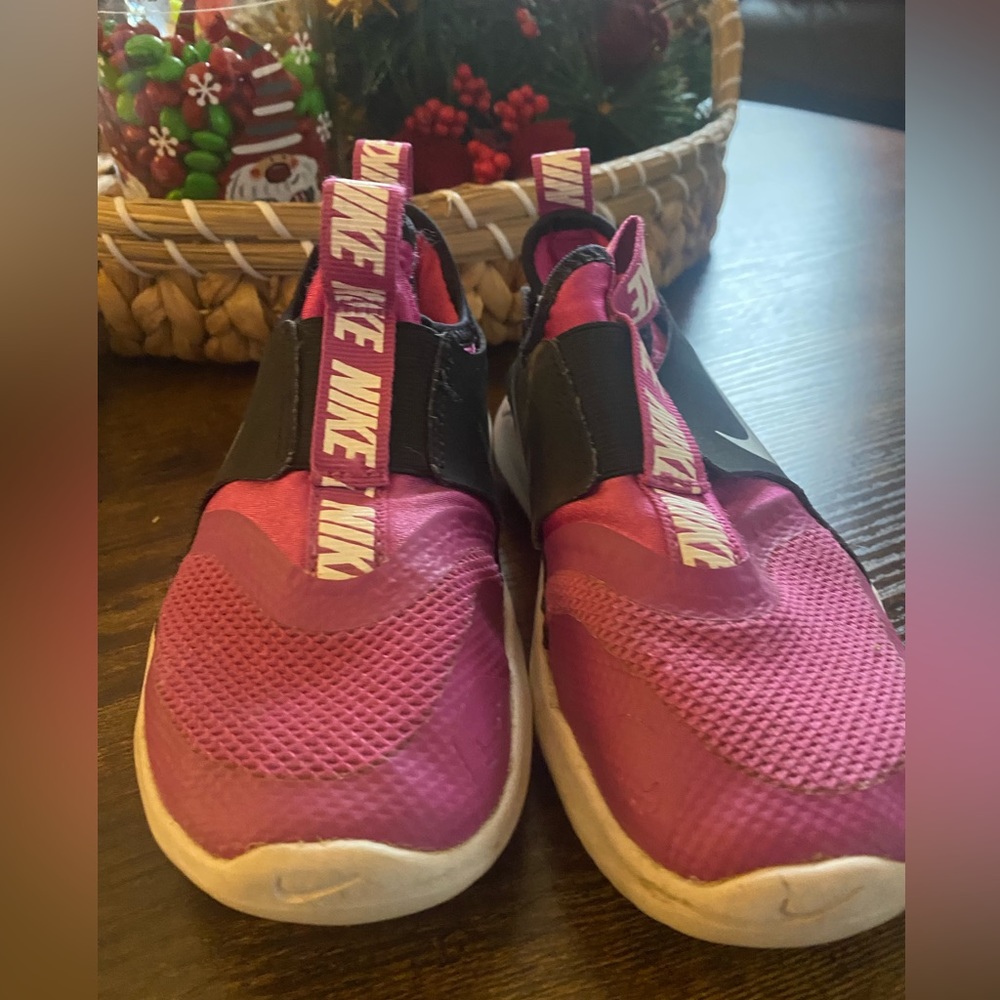 Girls Nike slip on sneakers.